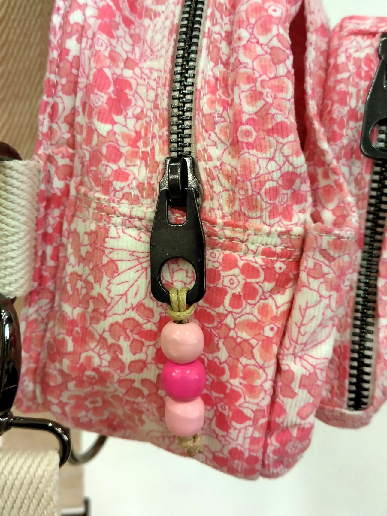 Mochila multiposición blanca y rosa